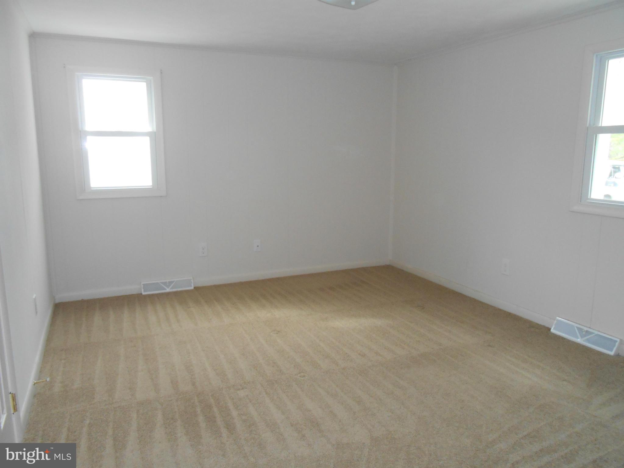 25371 B Three Notch Road Hollywood, MD 20636 - Photo 4 of 8 an empty room with a window