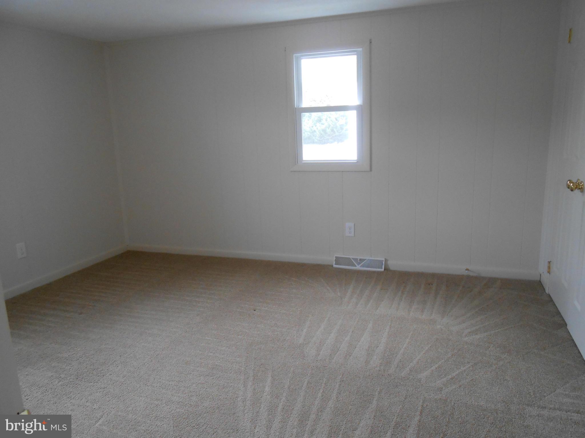 25371 B Three Notch Road Hollywood, MD 20636 - Photo 5 of 8 an empty room with a window