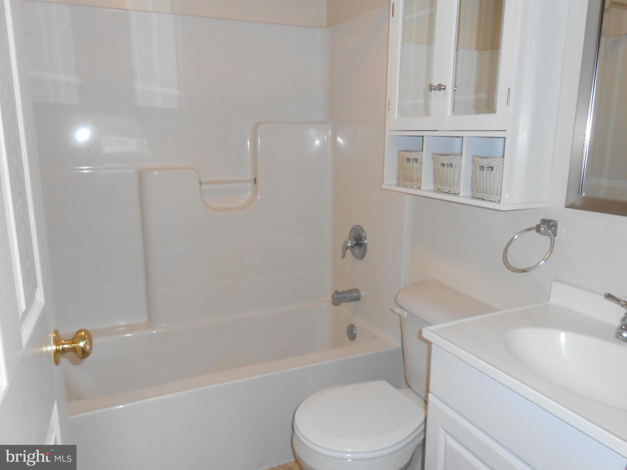 25371 B Three Notch Road Hollywood, MD 20636 - Photo 6 of 8 a bathroom with a sink a toilet and a bathtub