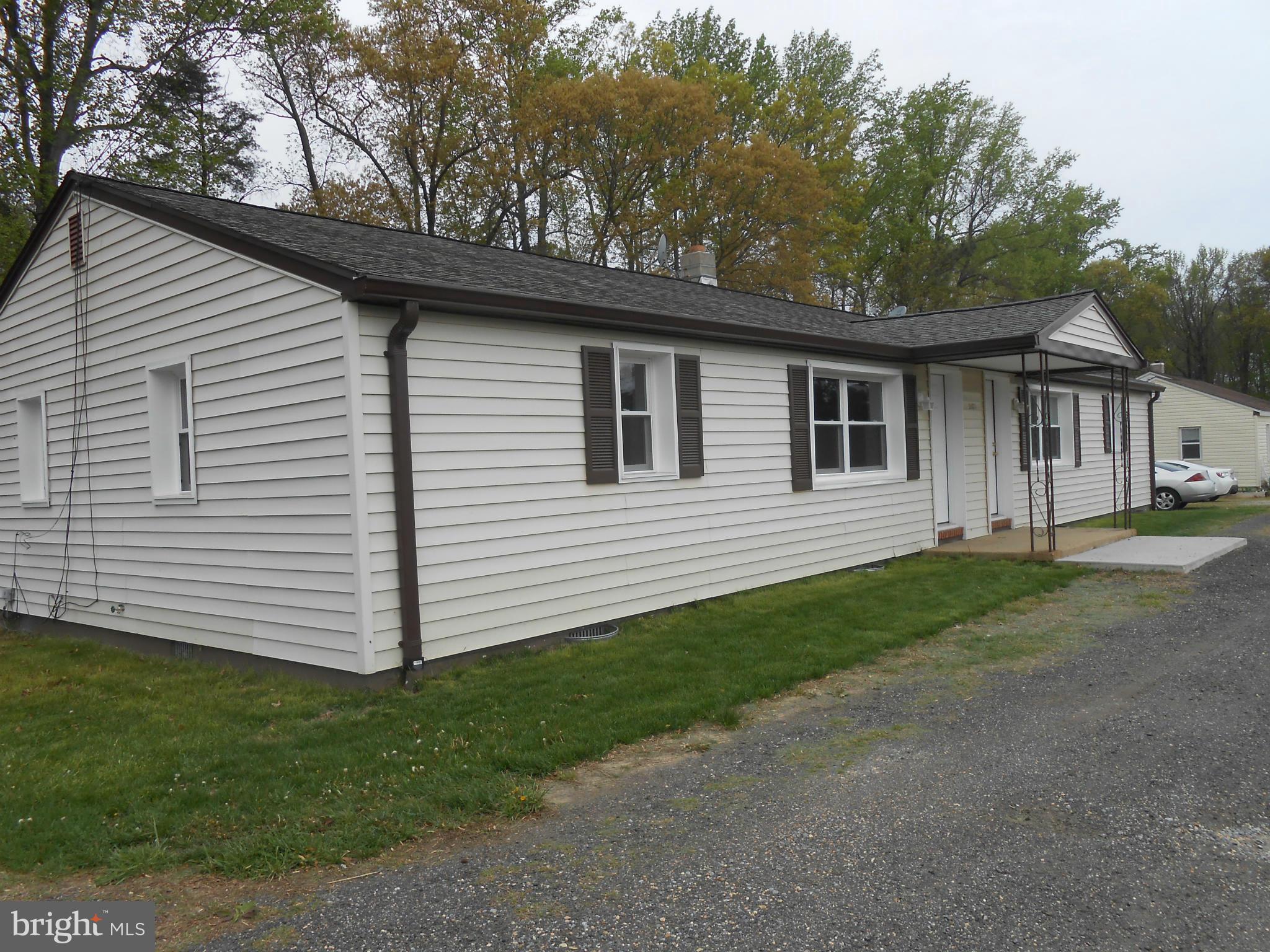 25371 B Three Notch Road Hollywood, MD 20636 - Photo 8 of 8 a front view of a house with a garden
