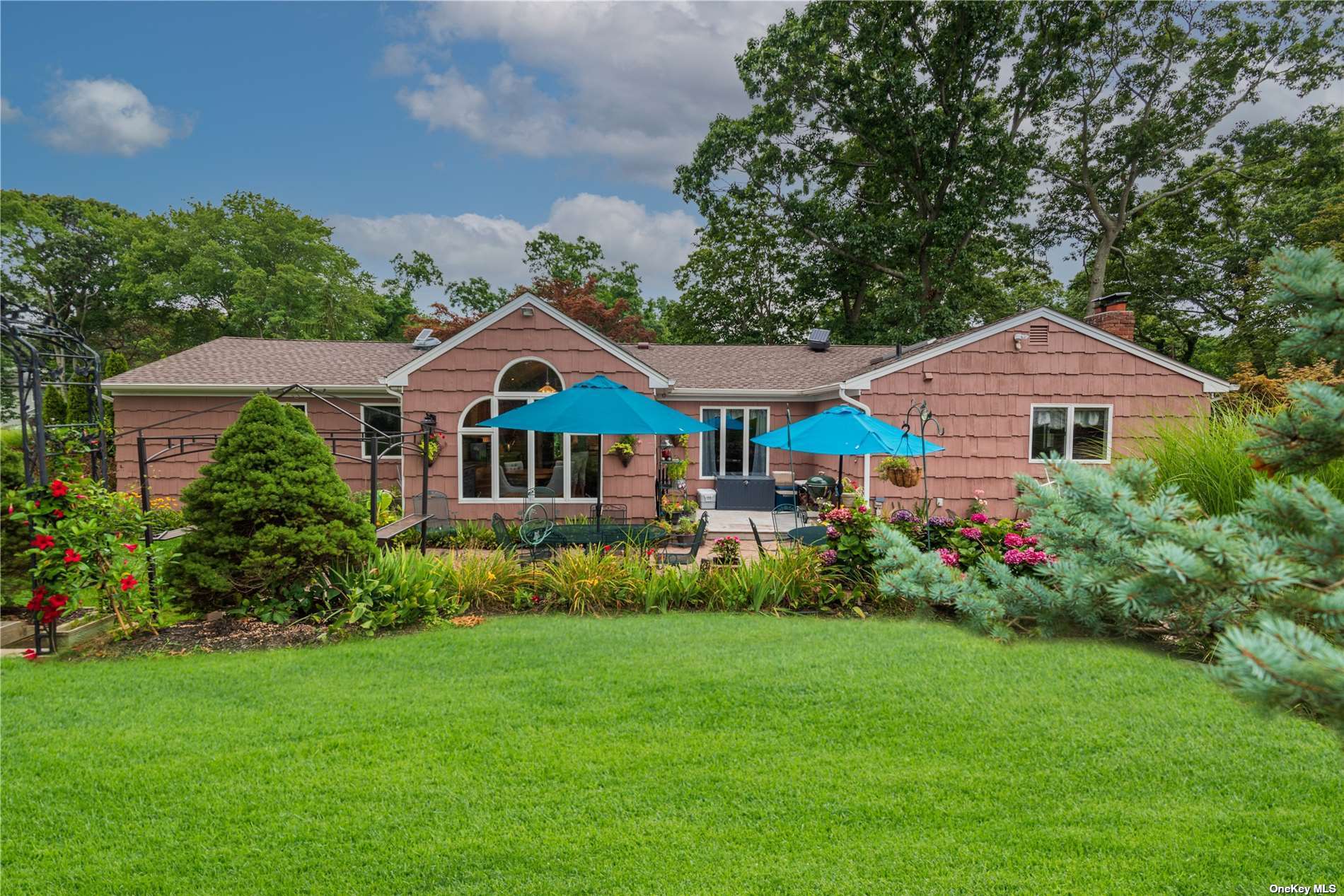 a front view of house with yard and green space