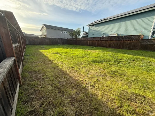 a view of a swimming pool with an outdoor space and seating area