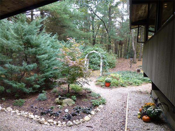 25 Belvedere Road Boxford, MA 01921 - Photo 14 of 16 a backyard of a house with a yard and outdoor seating