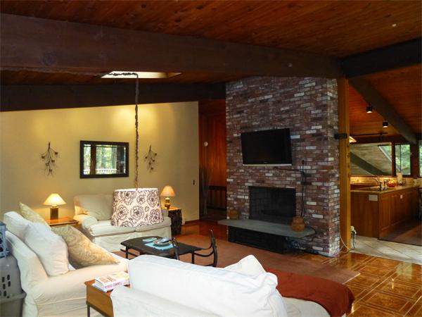 25 Belvedere Road Boxford, MA 01921 - Photo 8 of 16 a living room with furniture a flat screen tv and a fireplace