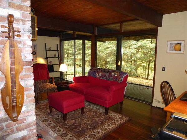 25 Belvedere Road Boxford, MA 01921 - Photo 9 of 16 a living room with furniture a rug and a floor to ceiling window