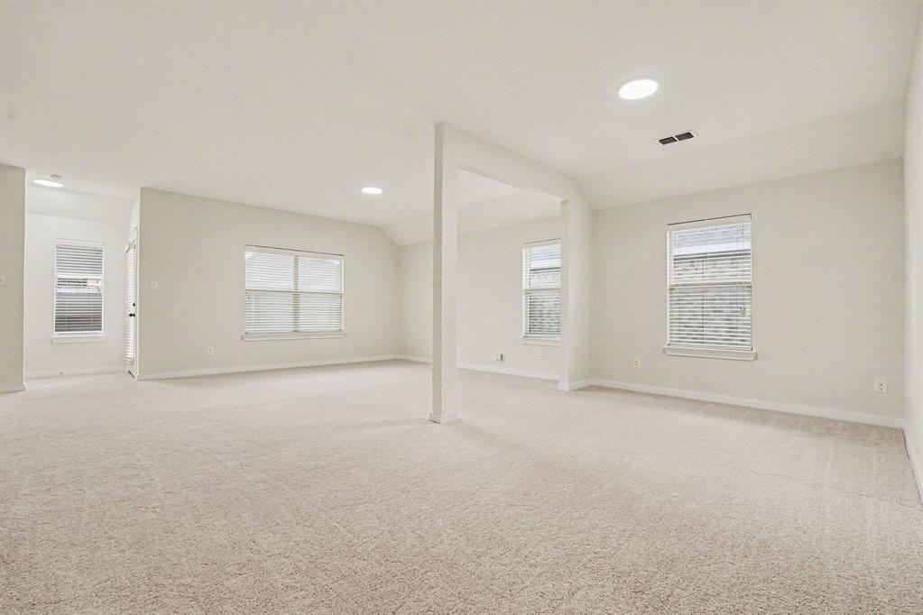 2606 Middleton Road Glenn Heights, TX 75154 - Photo 6 of 18 Expansive room with neutral carpeting, recessed ceiling lighting, and multiple windows with blinds