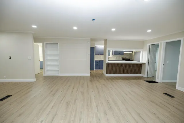 a view of a kitchen with a sink and a stove top oven