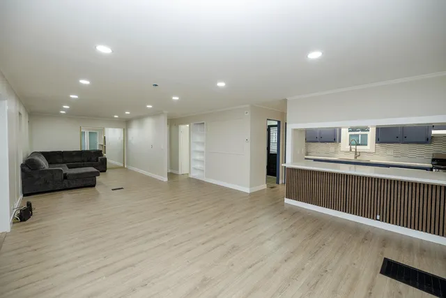 a view of kitchen with furniture and wooden floor