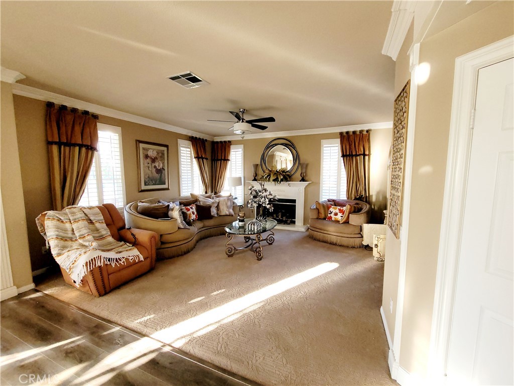 14119 Ashton Lane Riverside, CA 92508 - Photo 22 of 47 a living room with furniture and a large window