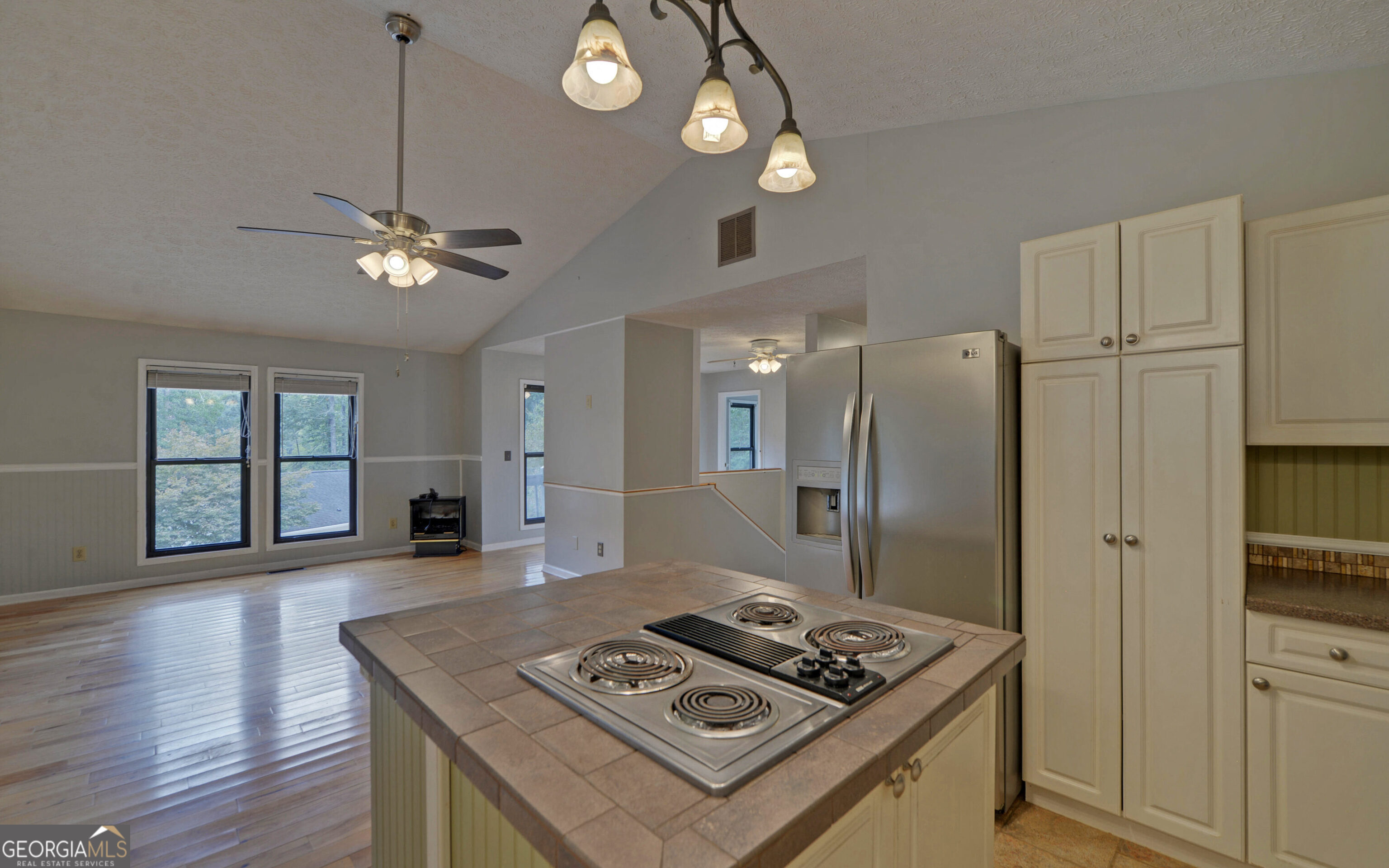 120 Ridgemore Circle Toccoa, GA 30577 - Photo 12 of 48 a kitchen with stainless steel appliances granite countertop a refrigerator a stove and a sink with wooden floor