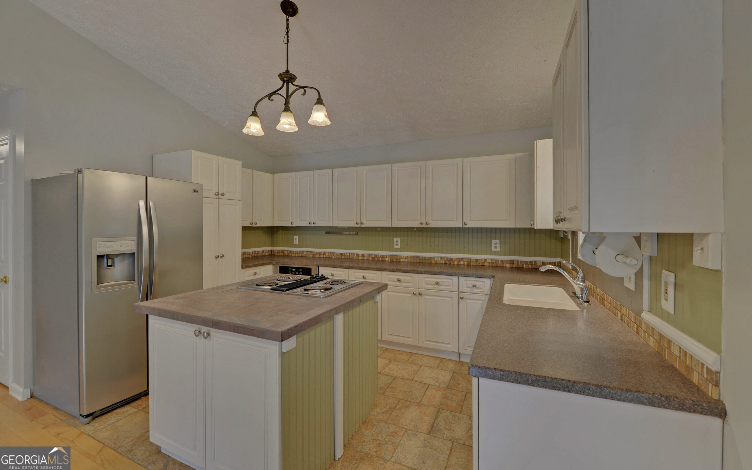 120 Ridgemore Circle Toccoa, GA 30577 - Photo 13 of 48 a kitchen with stainless steel appliances granite countertop a sink a refrigerator a stove a microwave and cabinets