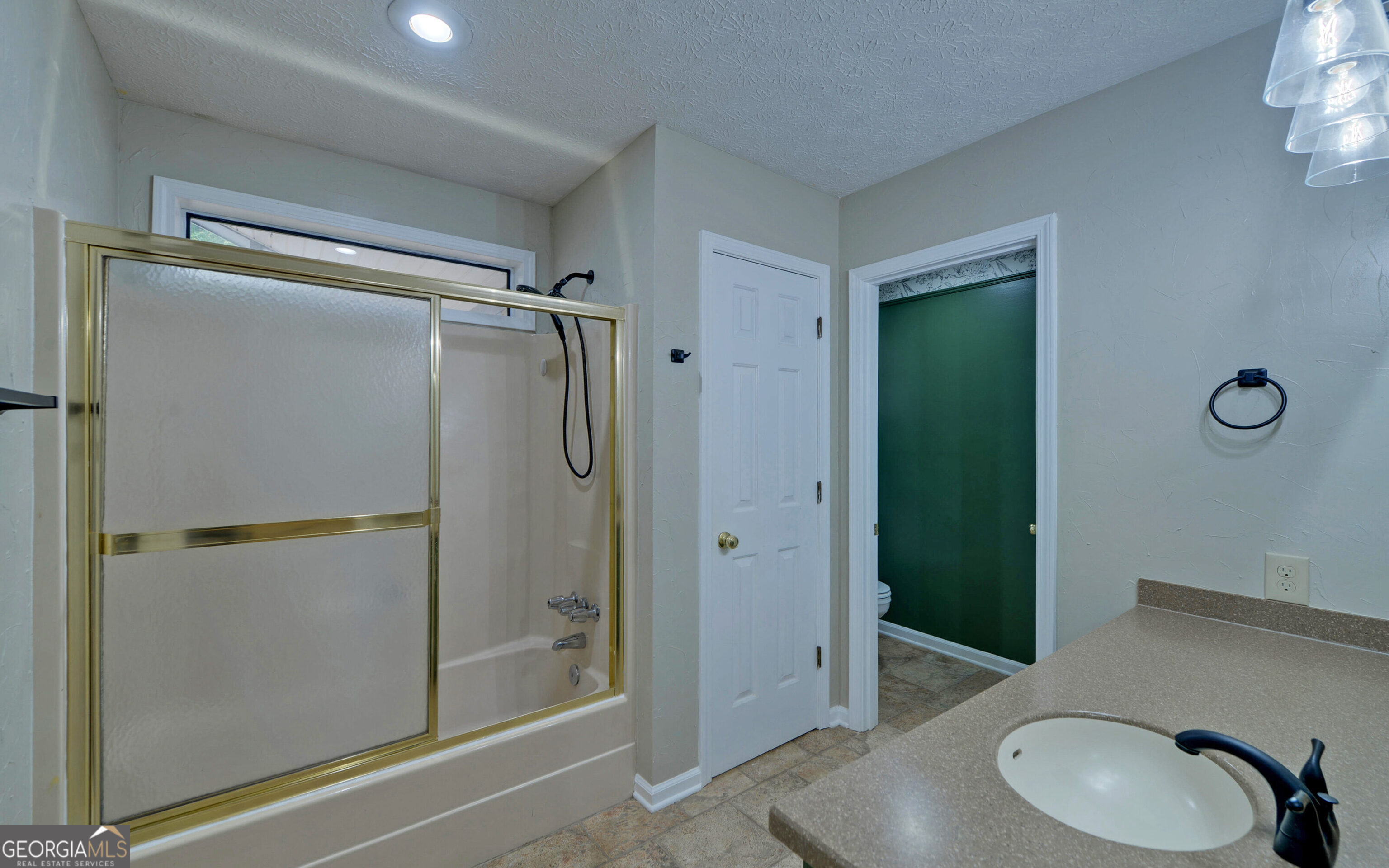 120 Ridgemore Circle Toccoa, GA 30577 - Photo 21 of 48 a bathroom with a granite countertop sink toilet and shower