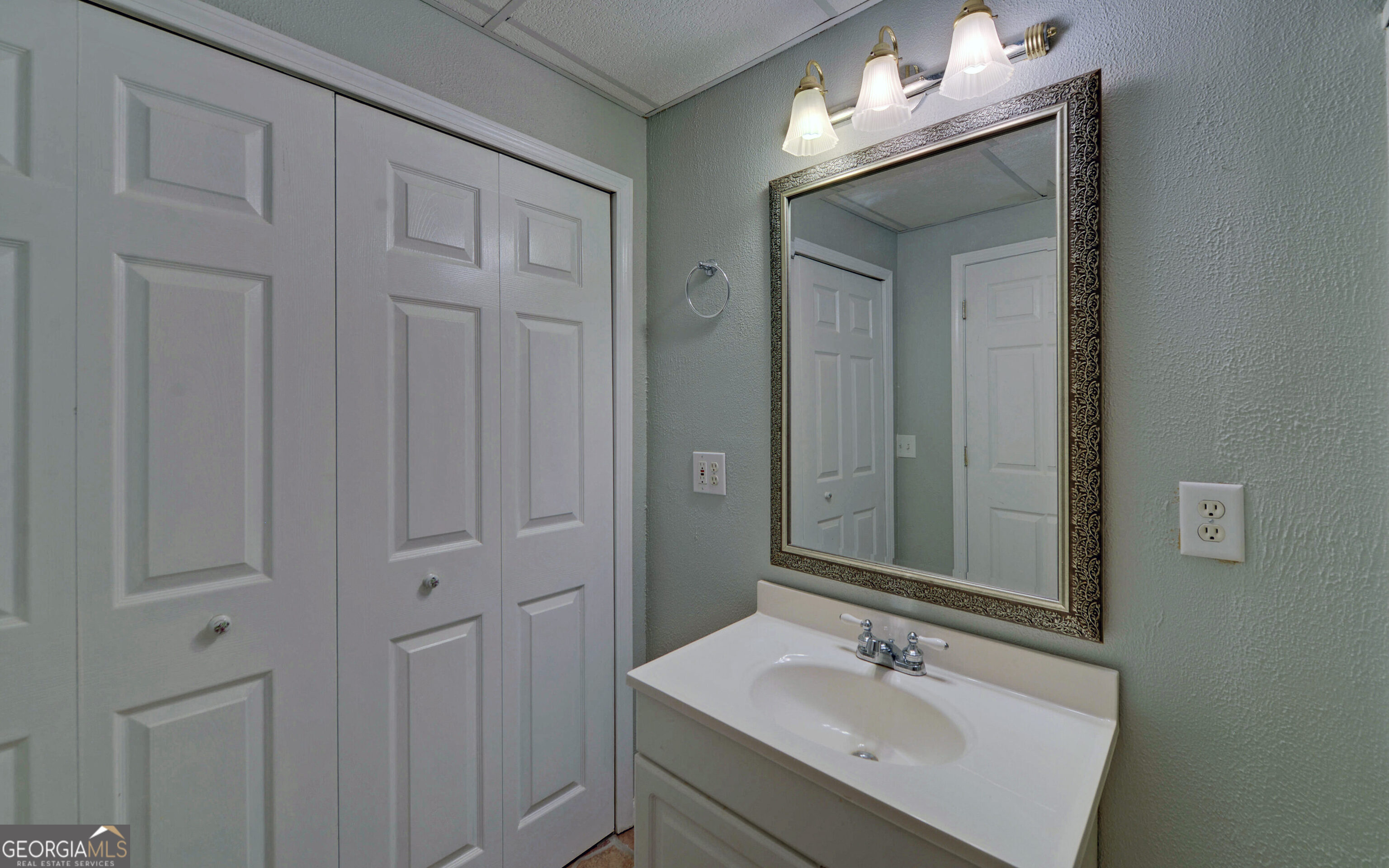 120 Ridgemore Circle Toccoa, GA 30577 - Photo 32 of 48 a bathroom with a sink vanity and mirror