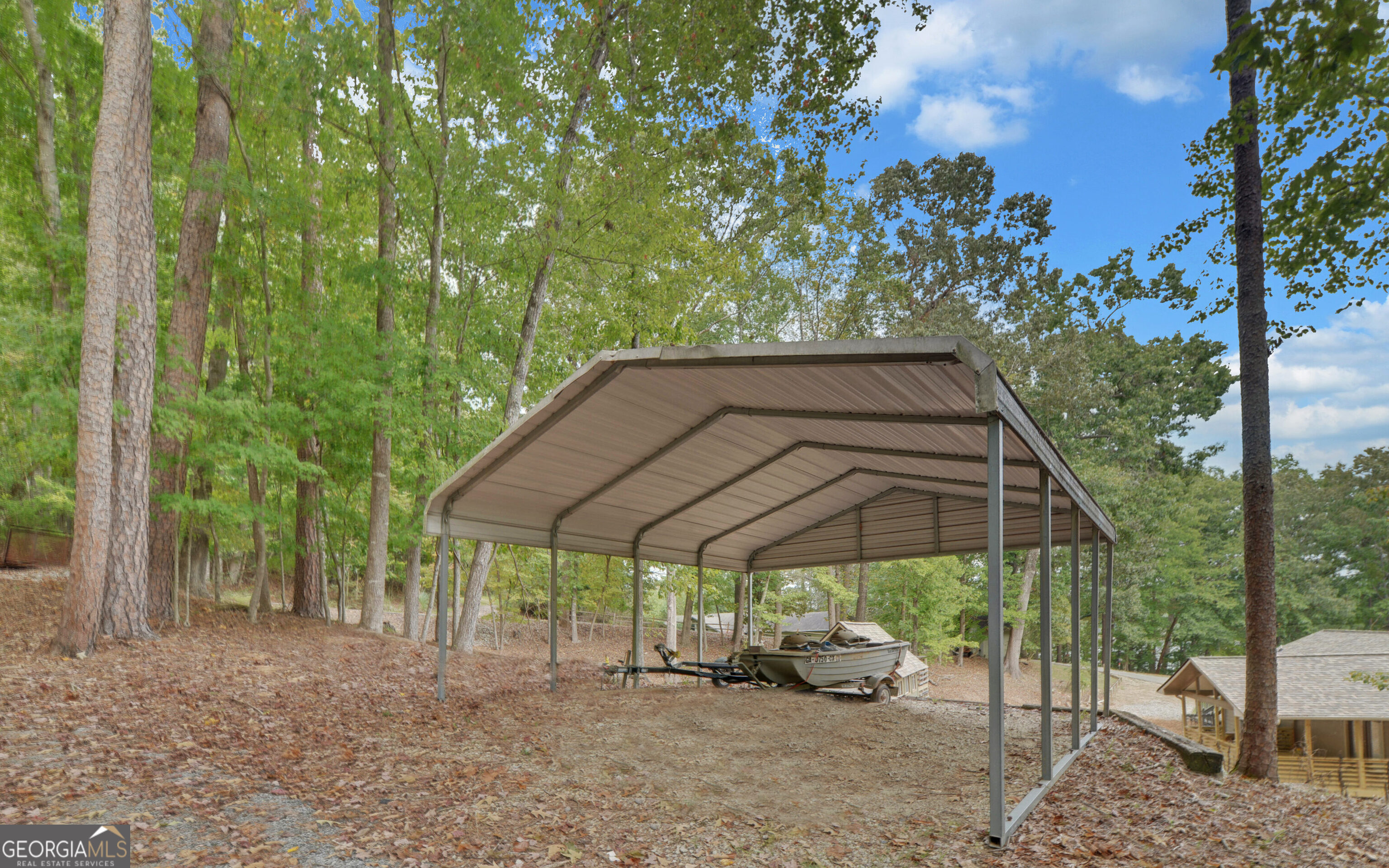 120 Ridgemore Circle Toccoa, GA 30577 - Photo 45 of 48 a view of patio with a table and chairs under an umbrella