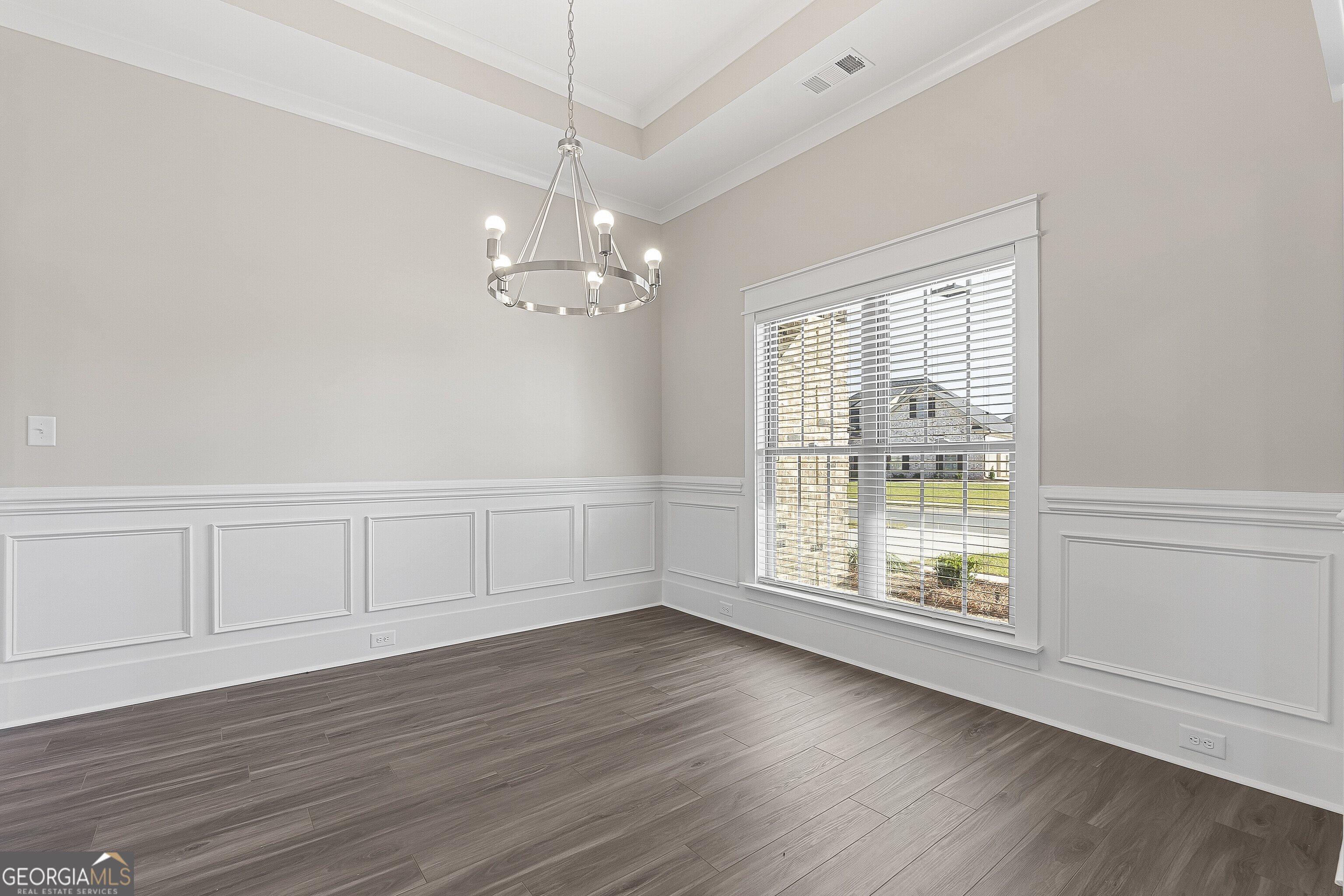 200 Emberwood Way Kathleen, GA 31047 - Photo 11 of 63 an empty room with wooden floor chandelier and windows