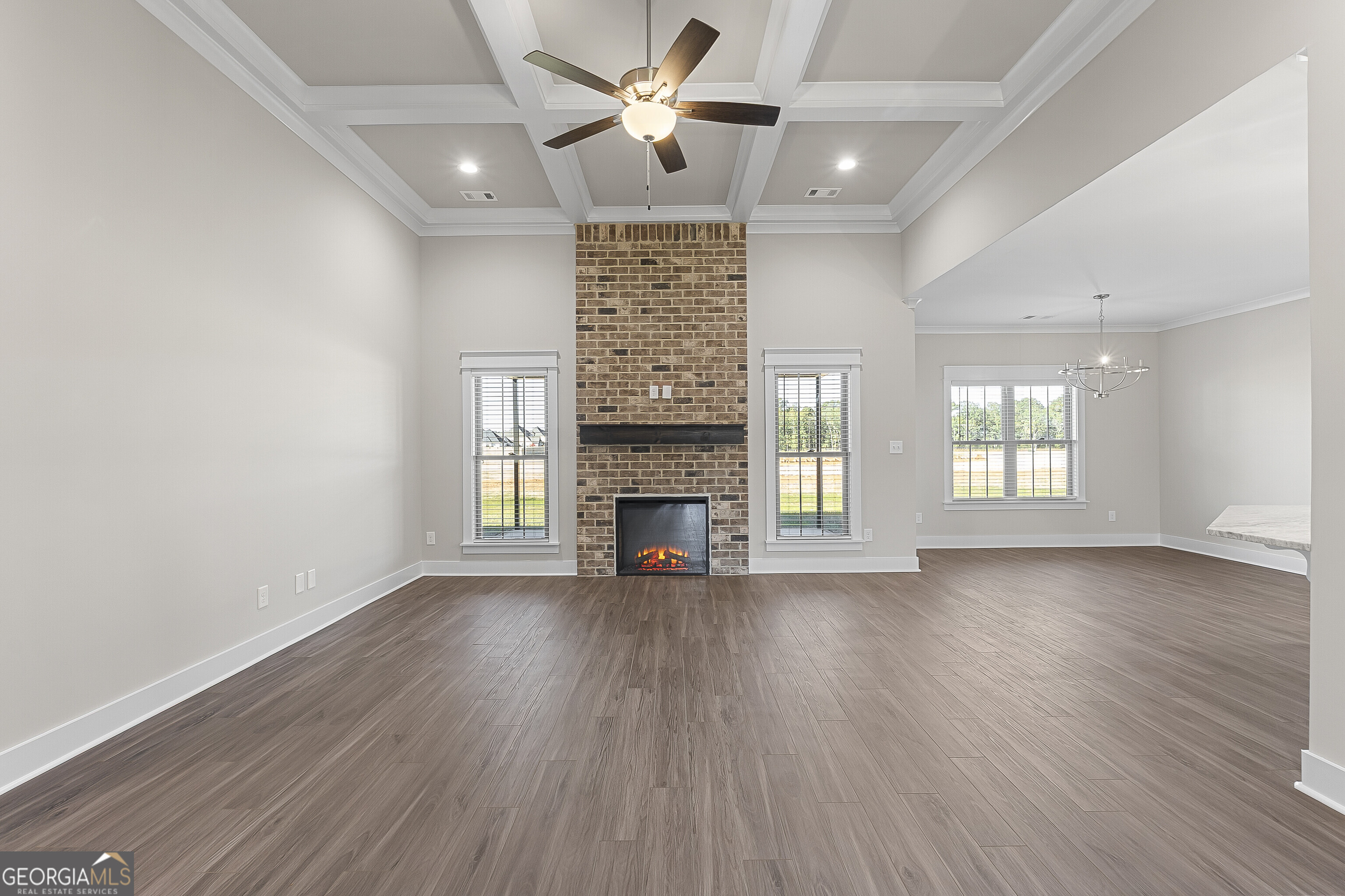 200 Emberwood Way Kathleen, GA 31047 - Photo 15 of 63 a view of an empty room with wooden floor fireplace and a window