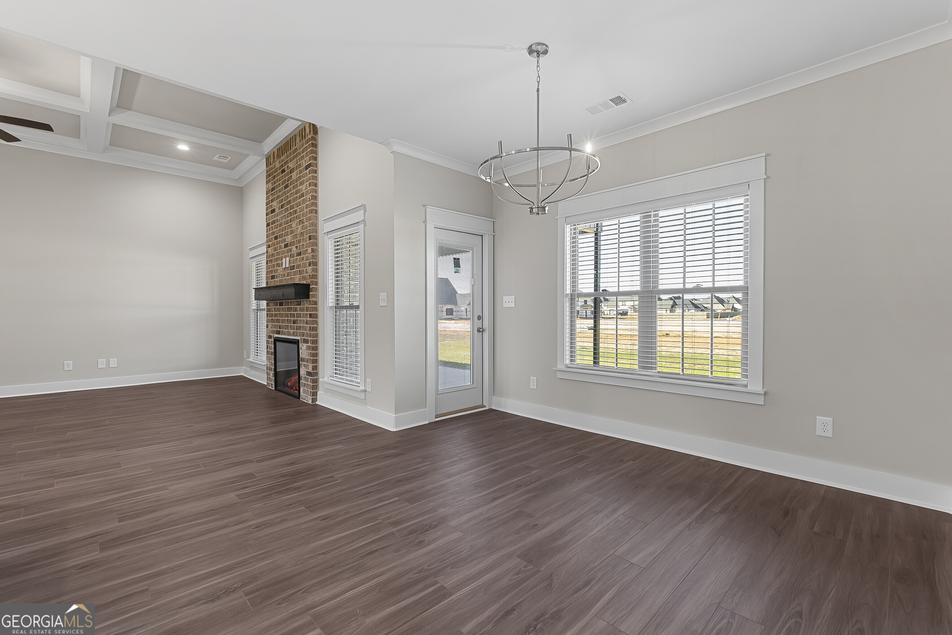 200 Emberwood Way Kathleen, GA 31047 - Photo 21 of 63 a view of an empty room with wooden floor and a window