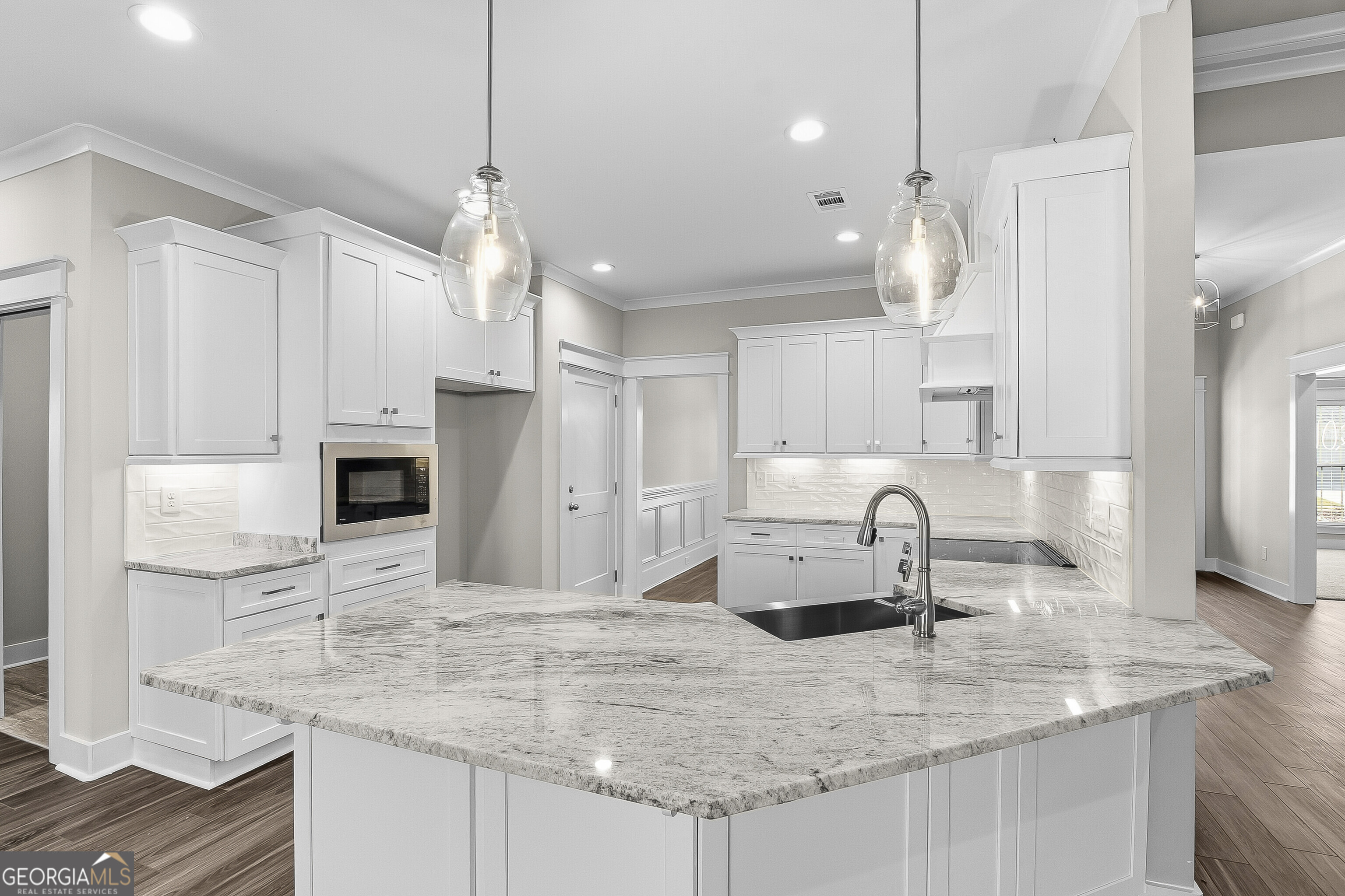200 Emberwood Way Kathleen, GA 31047 - Photo 23 of 63 a kitchen with kitchen island a sink stainless steel appliances and a counter top space