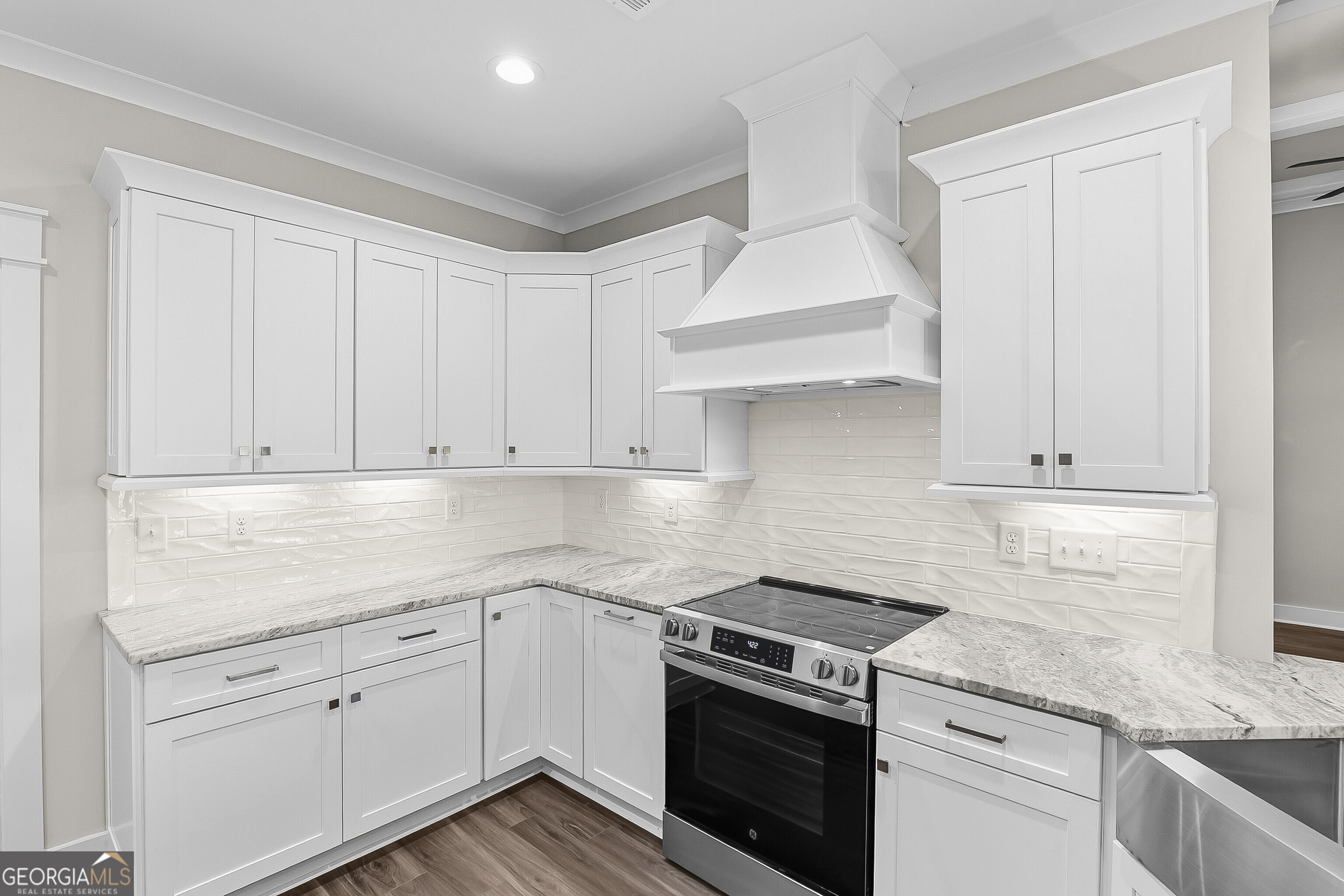 200 Emberwood Way Kathleen, GA 31047 - Photo 26 of 63 a kitchen with granite countertop white cabinets and white appliances