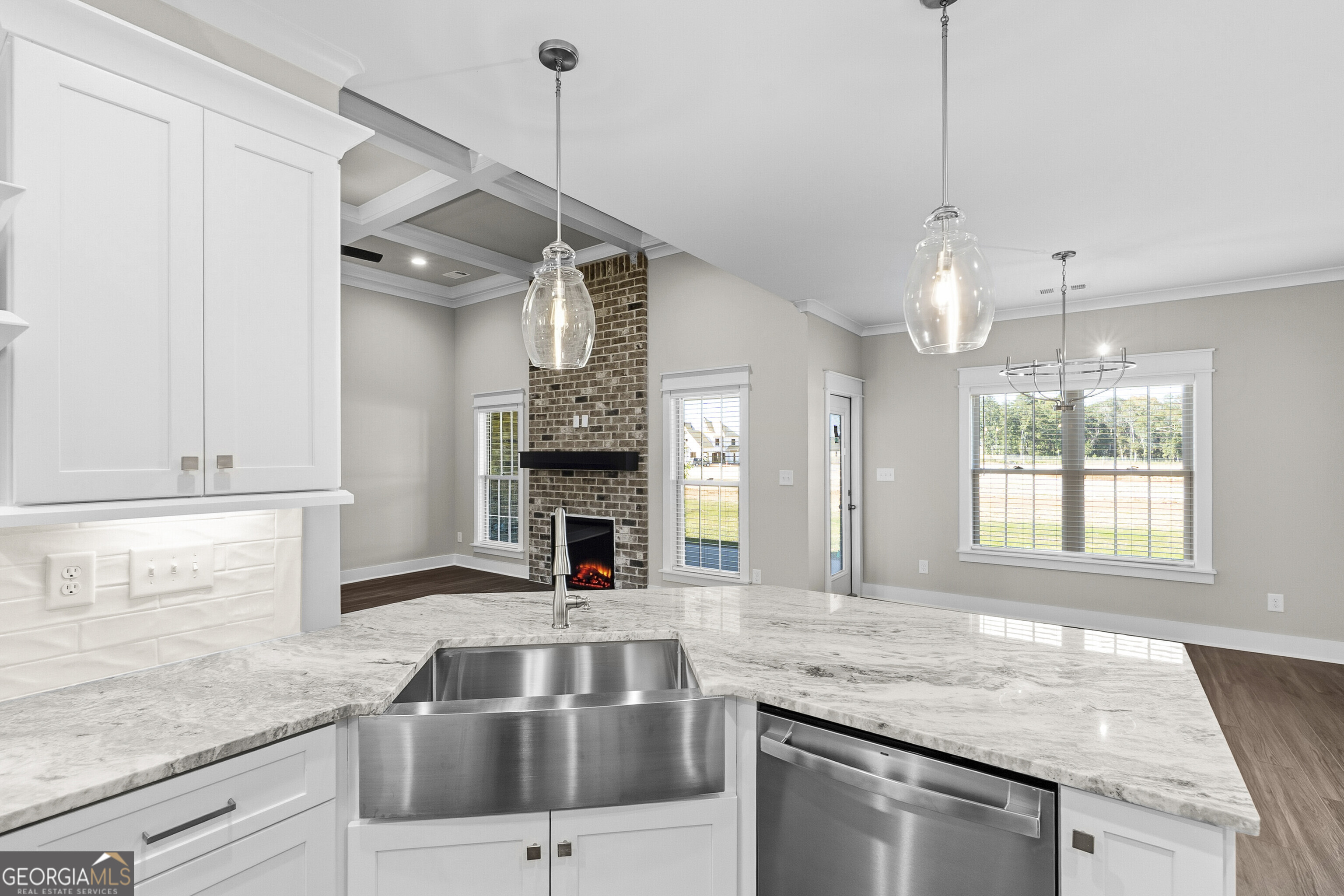 200 Emberwood Way Kathleen, GA 31047 - Photo 29 of 63 a kitchen with stainless steel appliances granite countertop a sink a stove and a wooden floor