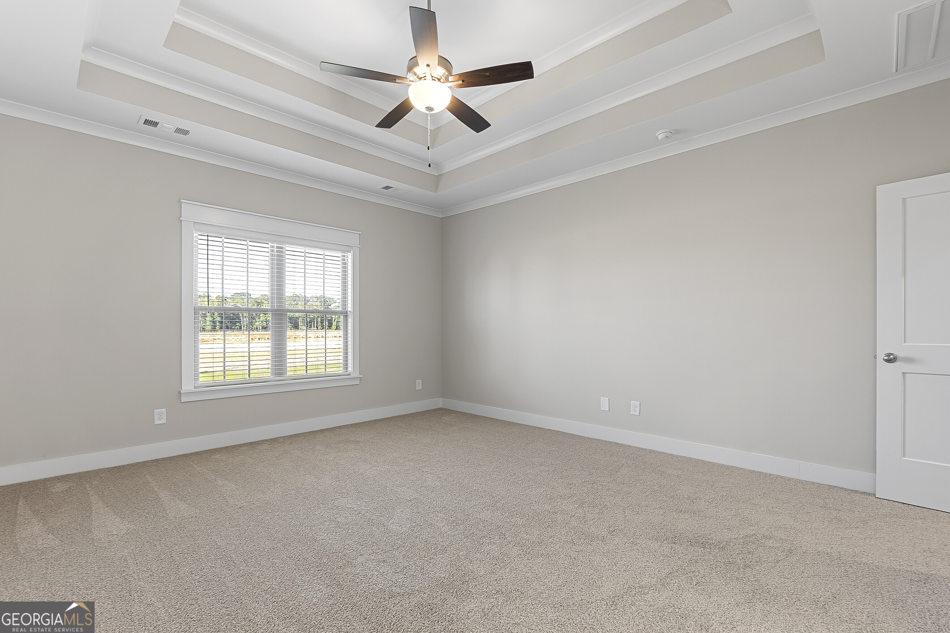 200 Emberwood Way Kathleen, GA 31047 - Photo 34 of 63 an empty room with a ceiling fan and windows