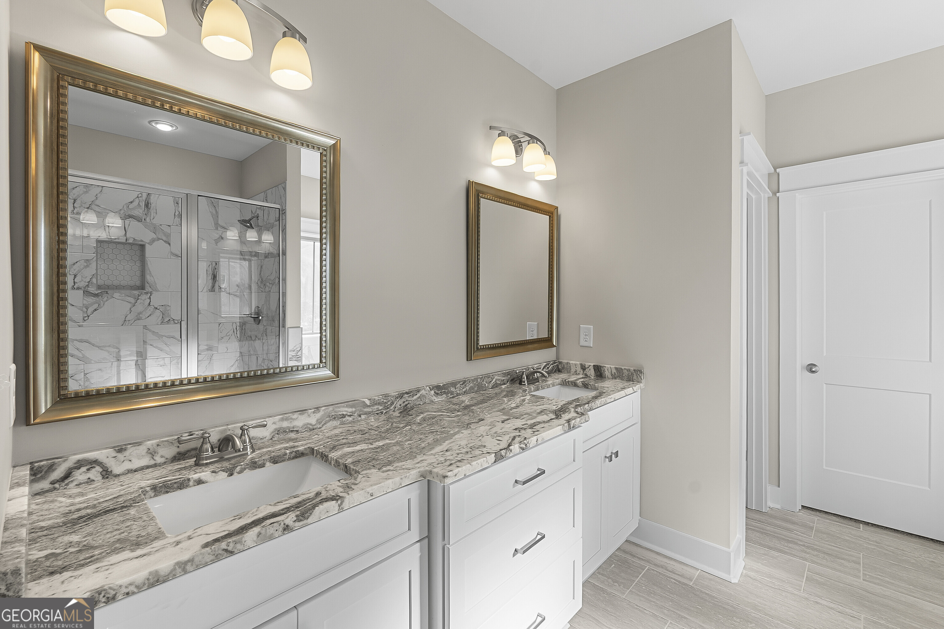 200 Emberwood Way Kathleen, GA 31047 - Photo 36 of 63 a bathroom with a granite countertop sink and a mirror