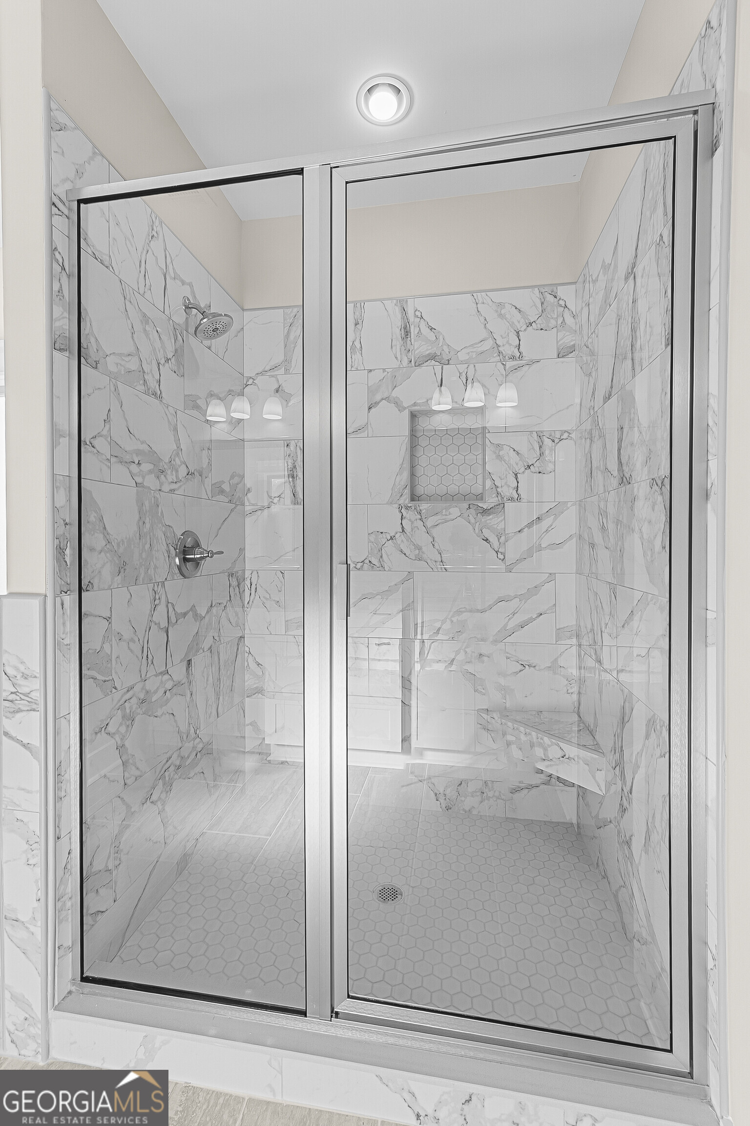 200 Emberwood Way Kathleen, GA 31047 - Photo 38 of 63 a bathroom with a glass shower door