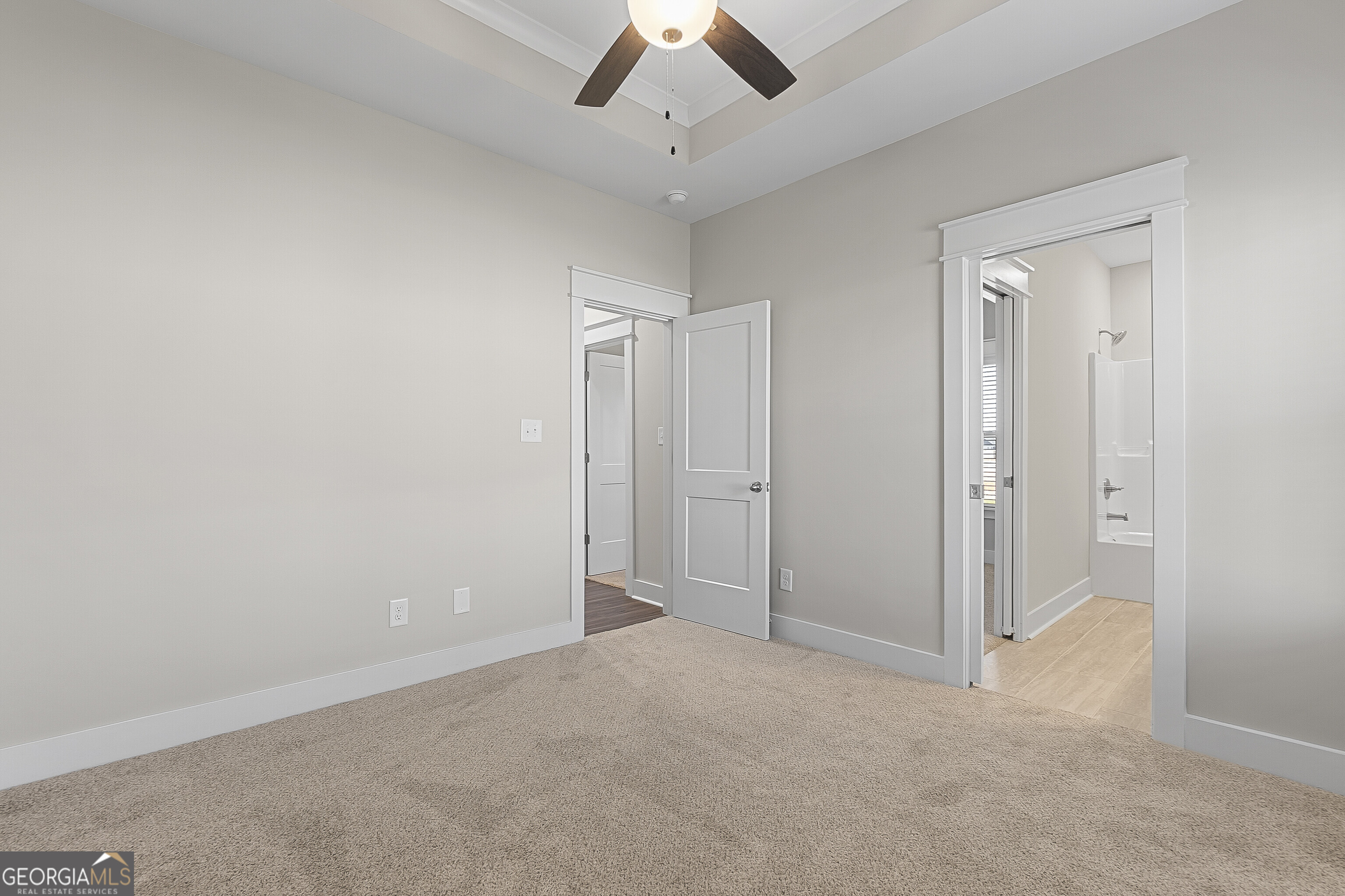 200 Emberwood Way Kathleen, GA 31047 - Photo 47 of 63 an empty room with a ceiling fan and a window