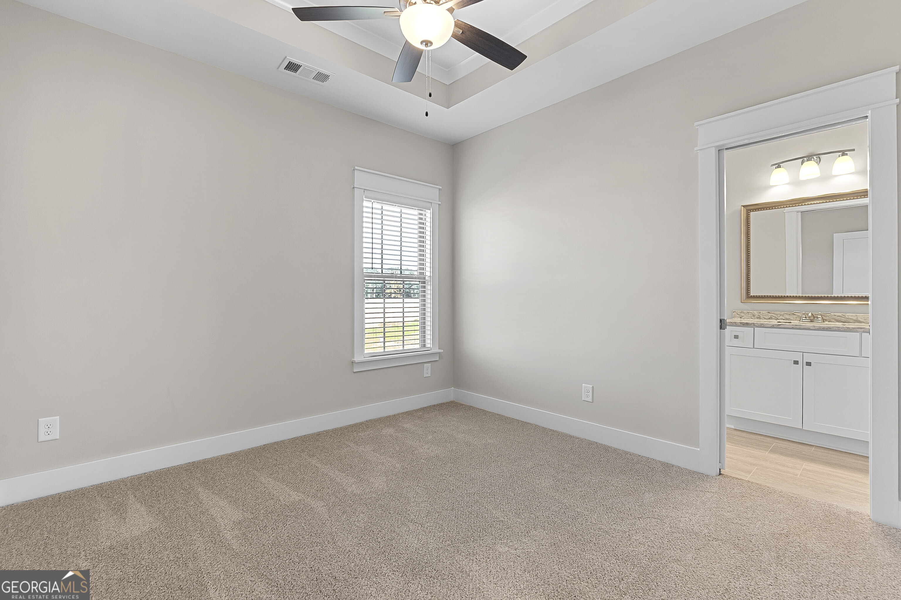 200 Emberwood Way Kathleen, GA 31047 - Photo 49 of 63 an empty room with chandelier fan and windows