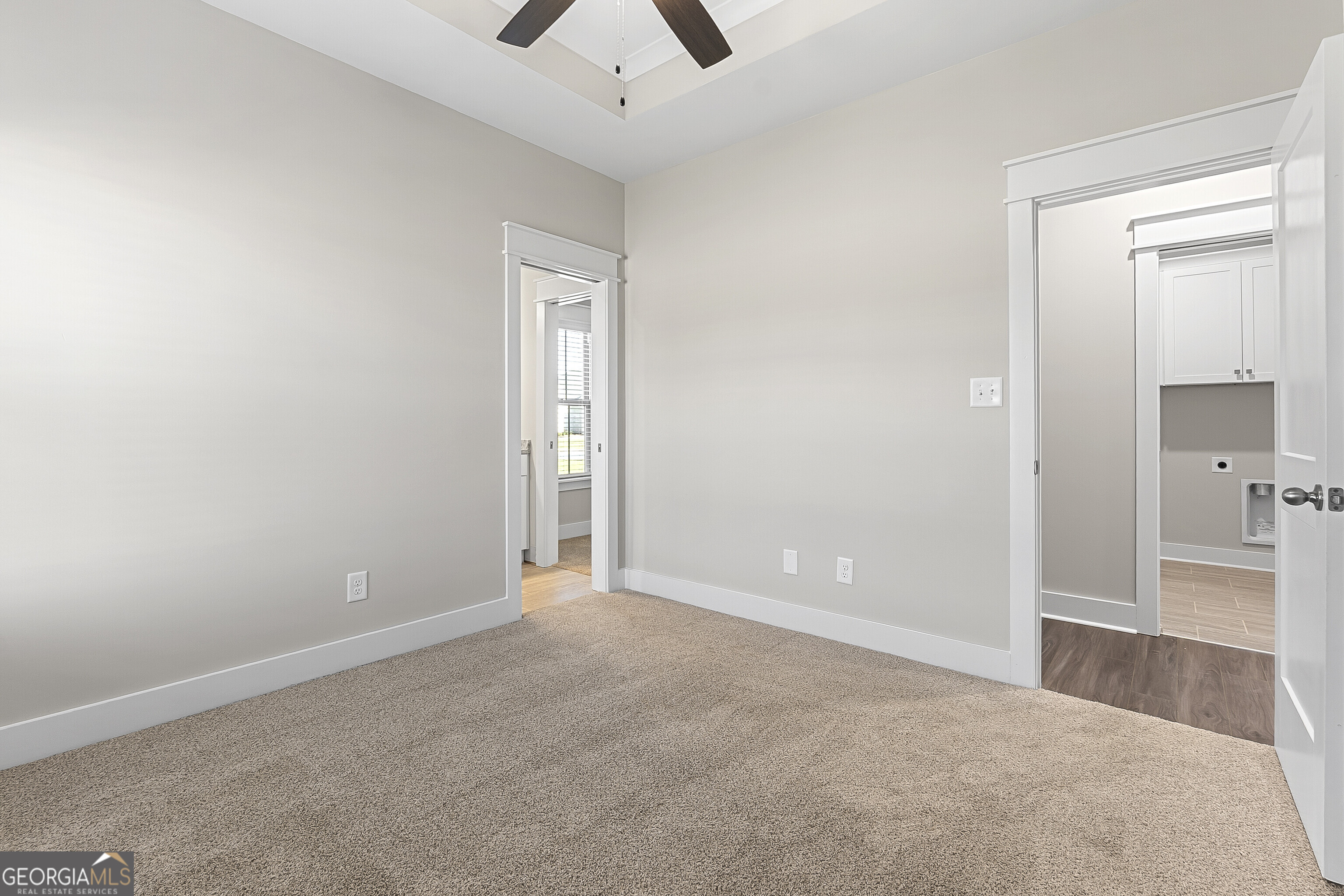 200 Emberwood Way Kathleen, GA 31047 - Photo 50 of 63 an empty room with closet and a chandelier fan