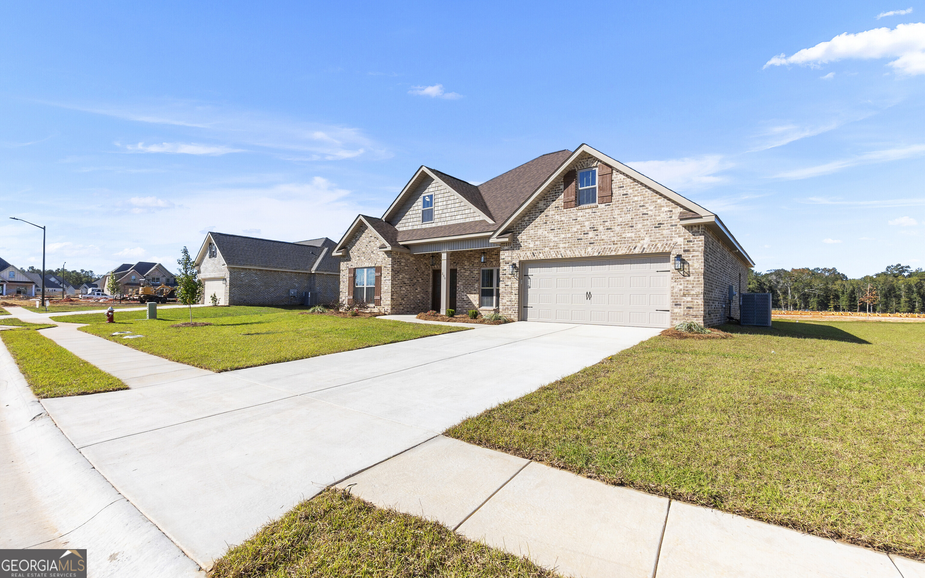 200 Emberwood Way Kathleen, GA 31047 - Photo 5 of 63 a view of a house with swimming pool and a yard