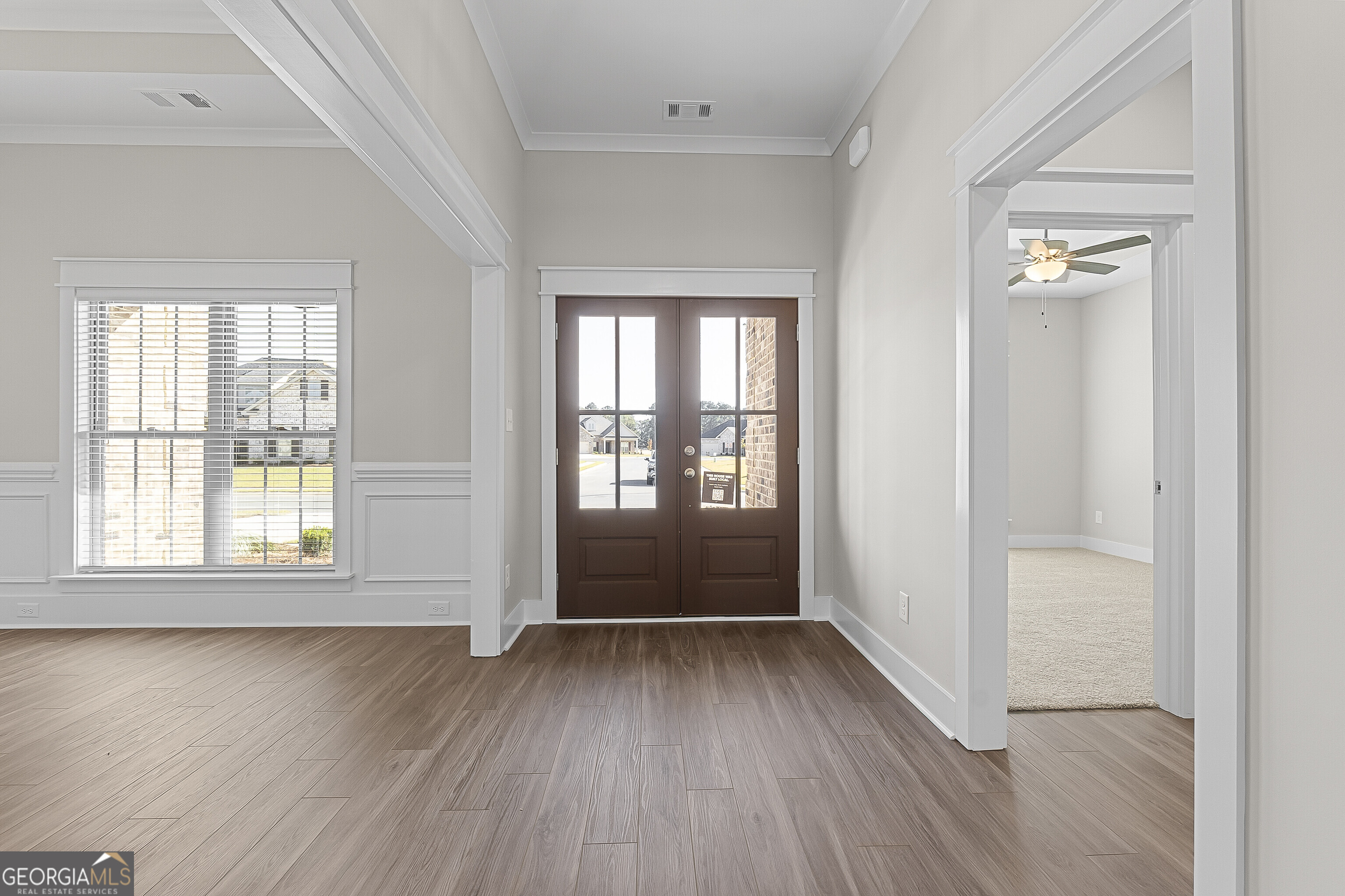 200 Emberwood Way Kathleen, GA 31047 - Photo 9 of 63 an empty room with wooden floor and windows