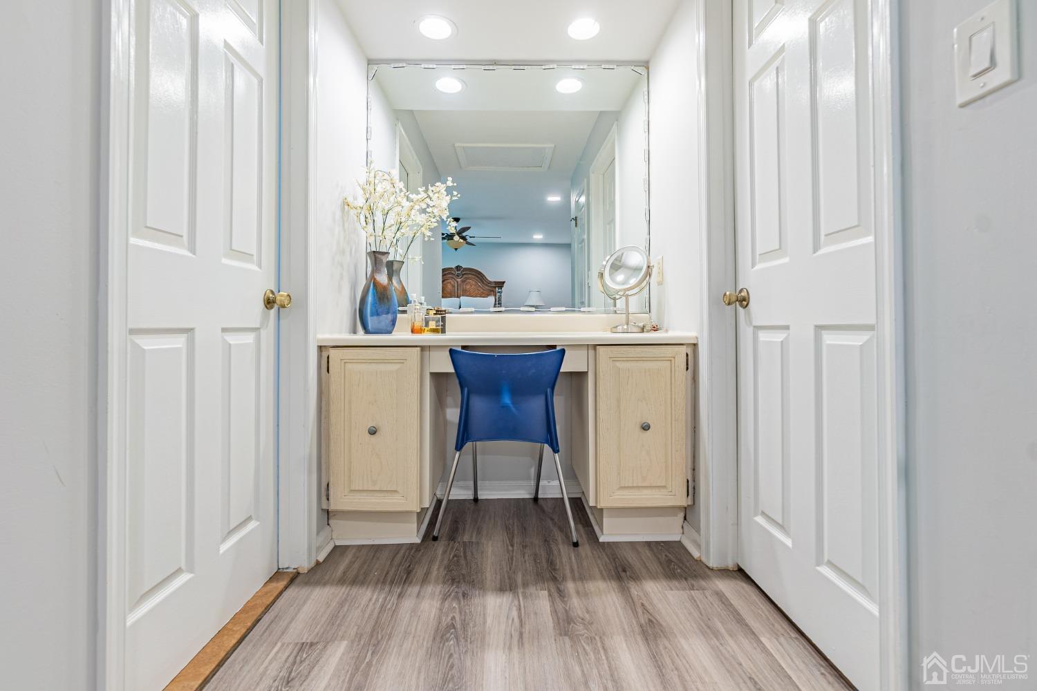 4603 Stonehedge Road Edison, NJ 08820 - Photo 22 of 35 a view of a hallway with wooden floor and staircase