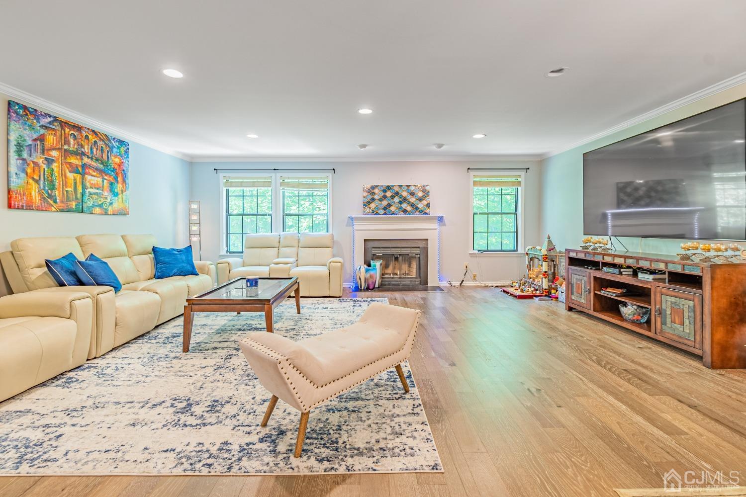 4603 Stonehedge Road Edison, NJ 08820 - Photo 8 of 35 a living room with furniture and a fireplace