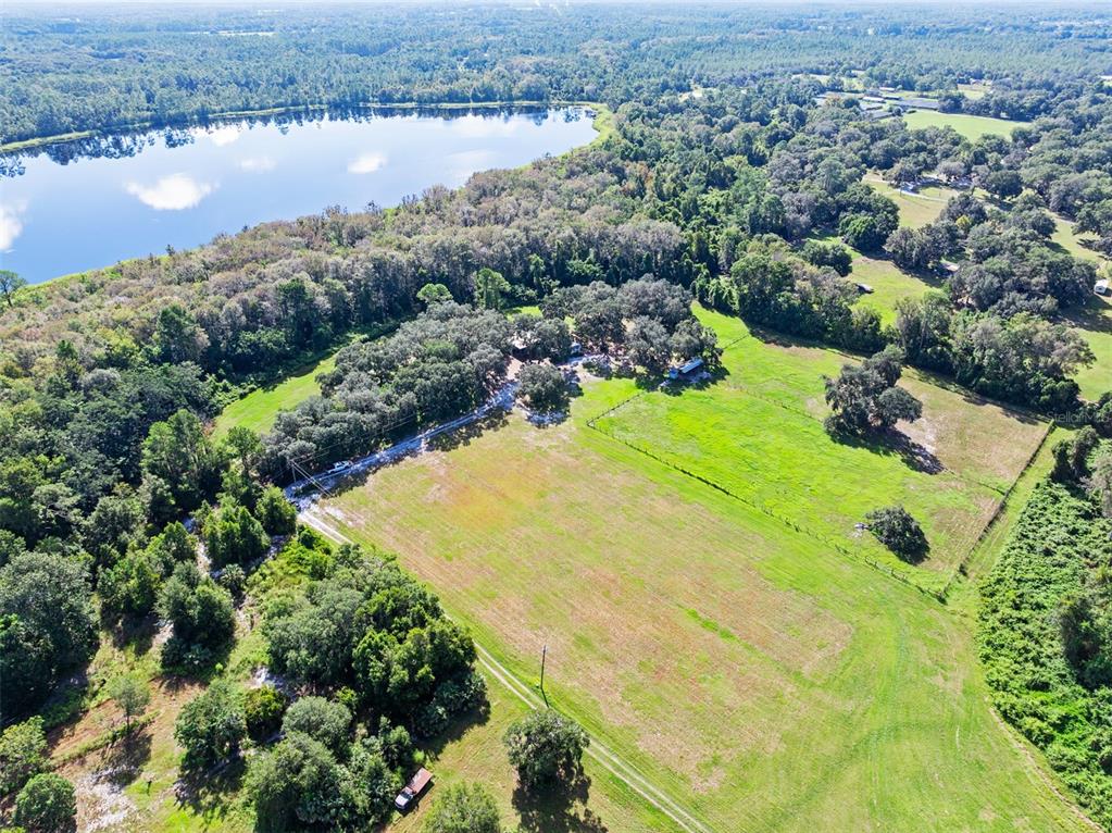 Roberts Road Pierson, FL 32180 - Photo 17 of 36 an aerial view of residential houses with outdoor space and lake view