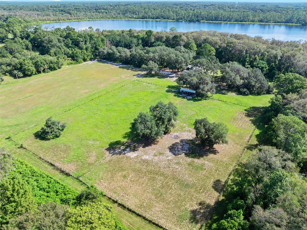 Roberts Road Pierson, FL 32180 - Photo 21 of 36 a view of a lake with a yard