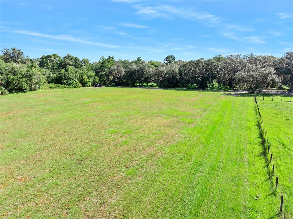 Roberts Road Pierson, FL 32180 - Photo 24 of 36 a view of a field with an trees