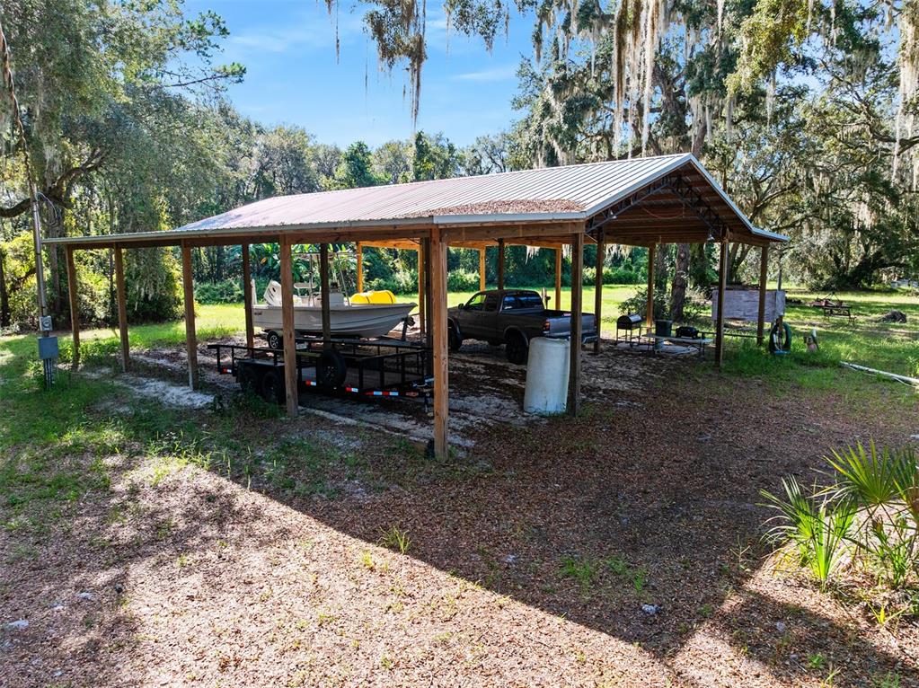 Roberts Road Pierson, FL 32180 - Photo 27 of 36 a view of a house with backyard porch and sitting area