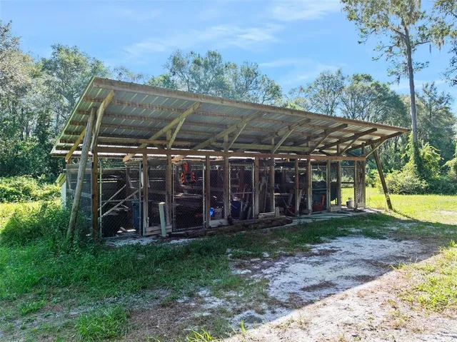 a view of a chair and table under an umbrella