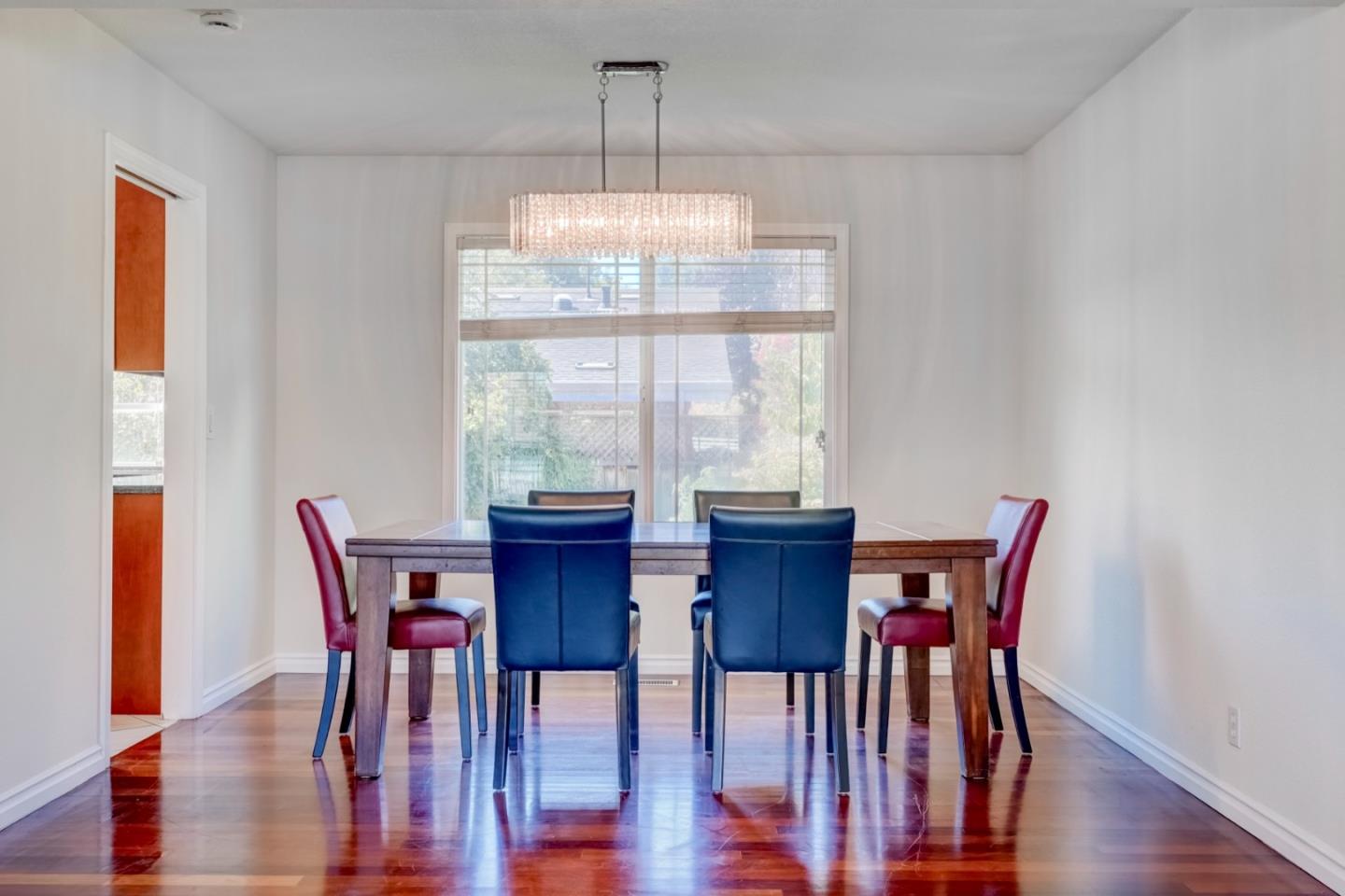2321 Oak Flat Road San Jose, CA 95131 - Photo 11 of 43 a view of a dining room with furniture window and wooden floor