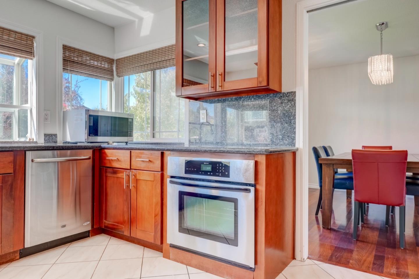 2321 Oak Flat Road San Jose, CA 95131 - Photo 15 of 43 a kitchen with stainless steel appliances granite countertop a stove a sink and cabinets