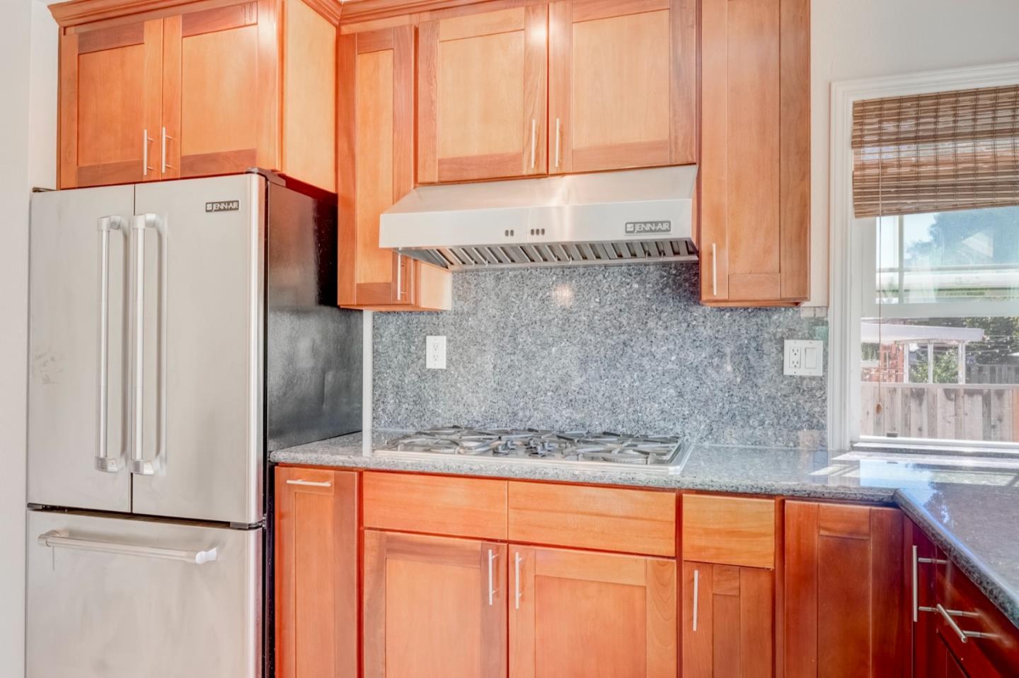 2321 Oak Flat Road San Jose, CA 95131 - Photo 17 of 43 a kitchen with stainless steel appliances granite countertop a sink and a refrigerator