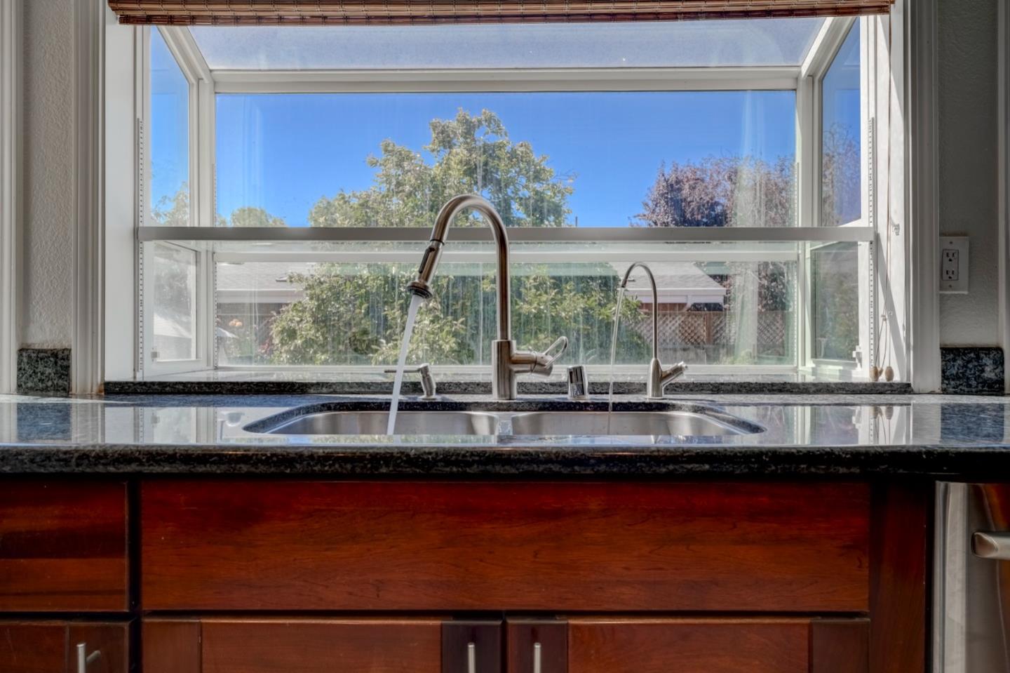 2321 Oak Flat Road San Jose, CA 95131 - Photo 18 of 43 a view of a kitchen with kitchen island and a large window