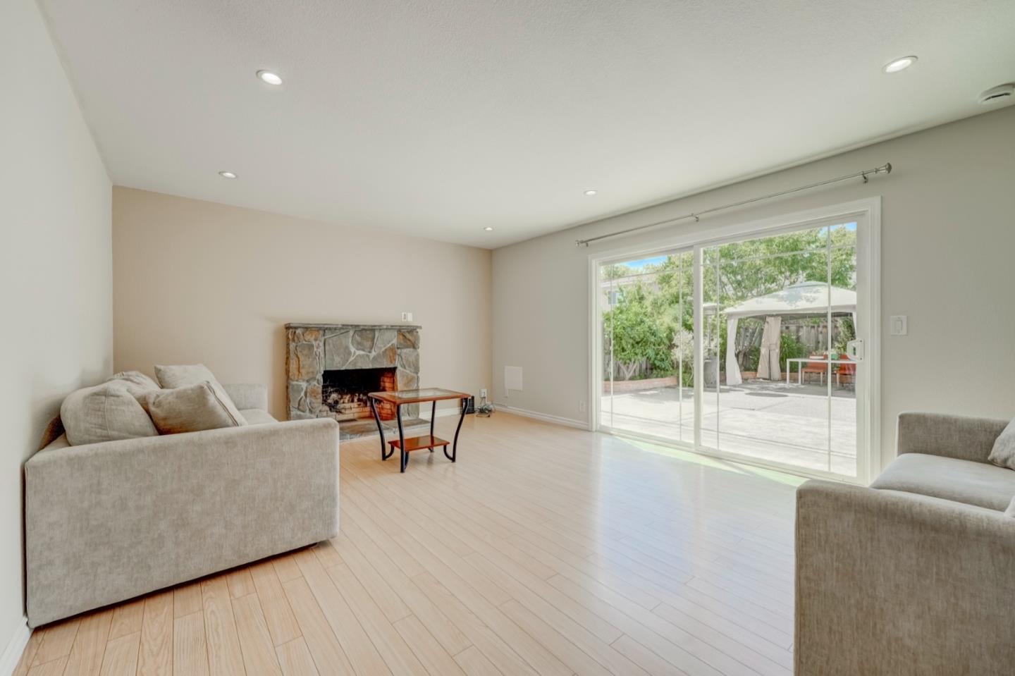 2321 Oak Flat Road San Jose, CA 95131 - Photo 20 of 43 a living room with furniture and a fireplace
