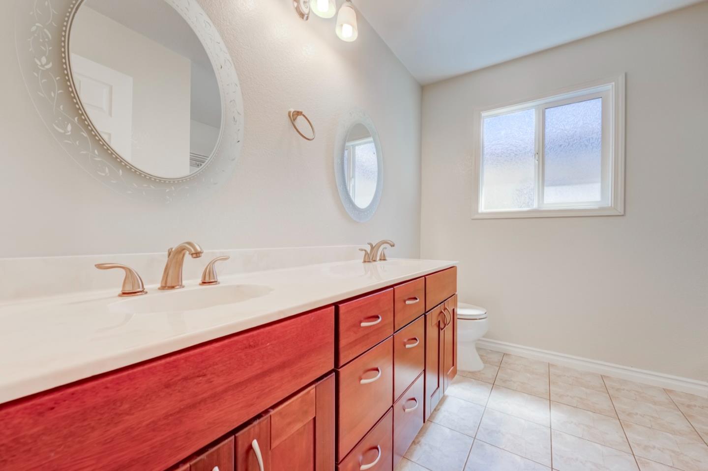 2321 Oak Flat Road San Jose, CA 95131 - Photo 38 of 43 a bathroom with a sink and a mirror