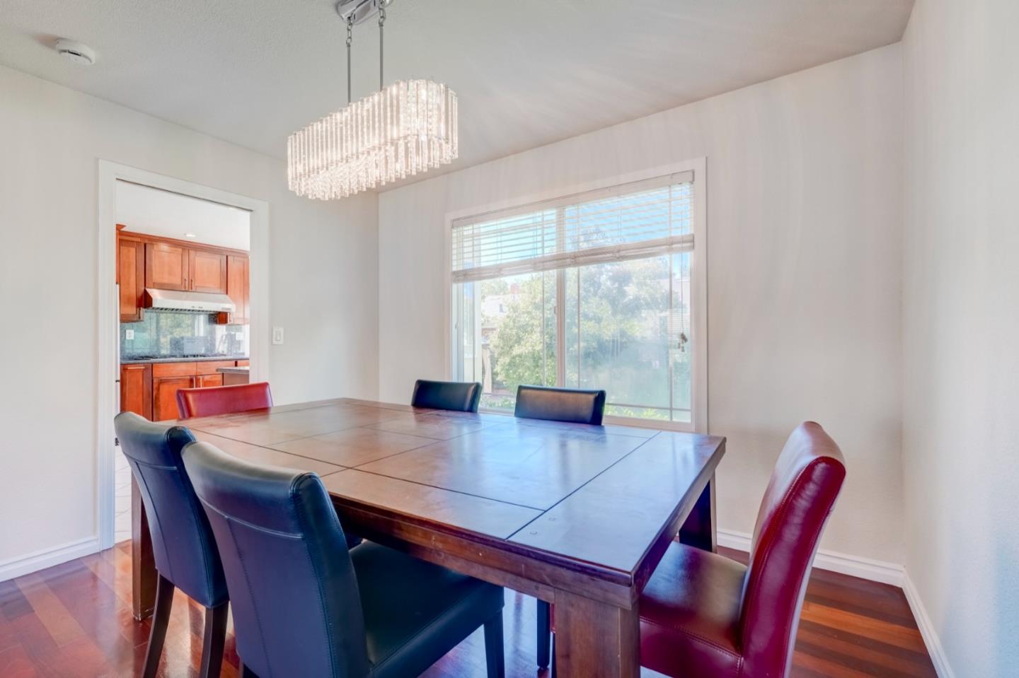 2321 Oak Flat Road San Jose, CA 95131 - Photo 9 of 43 a view of a dining room with furniture window and wooden floor