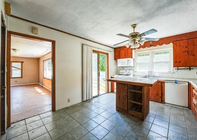 a view of a kitchen with a sink and a living room
