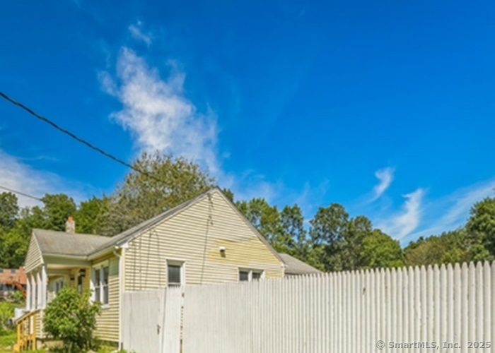 416 Hanover Road Scotland, CT 06330 - Photo 6 of 20 a view of a house with a yard