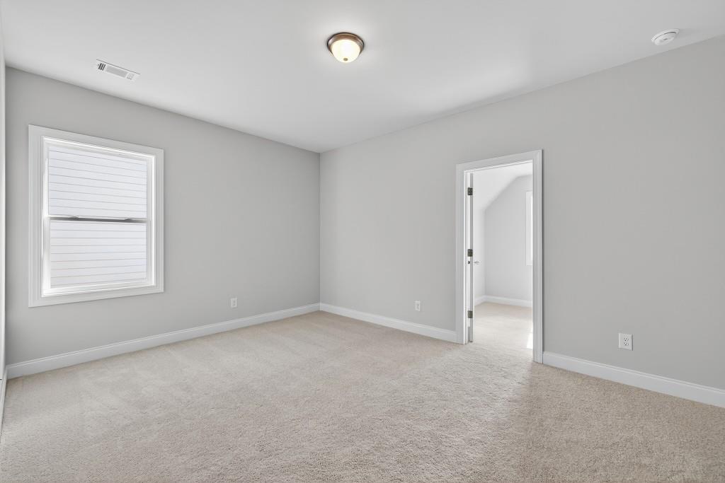 5566 Spring Street Flowery Branch, GA 30542 - Photo 24 of 66 an empty room with a empty space and a window