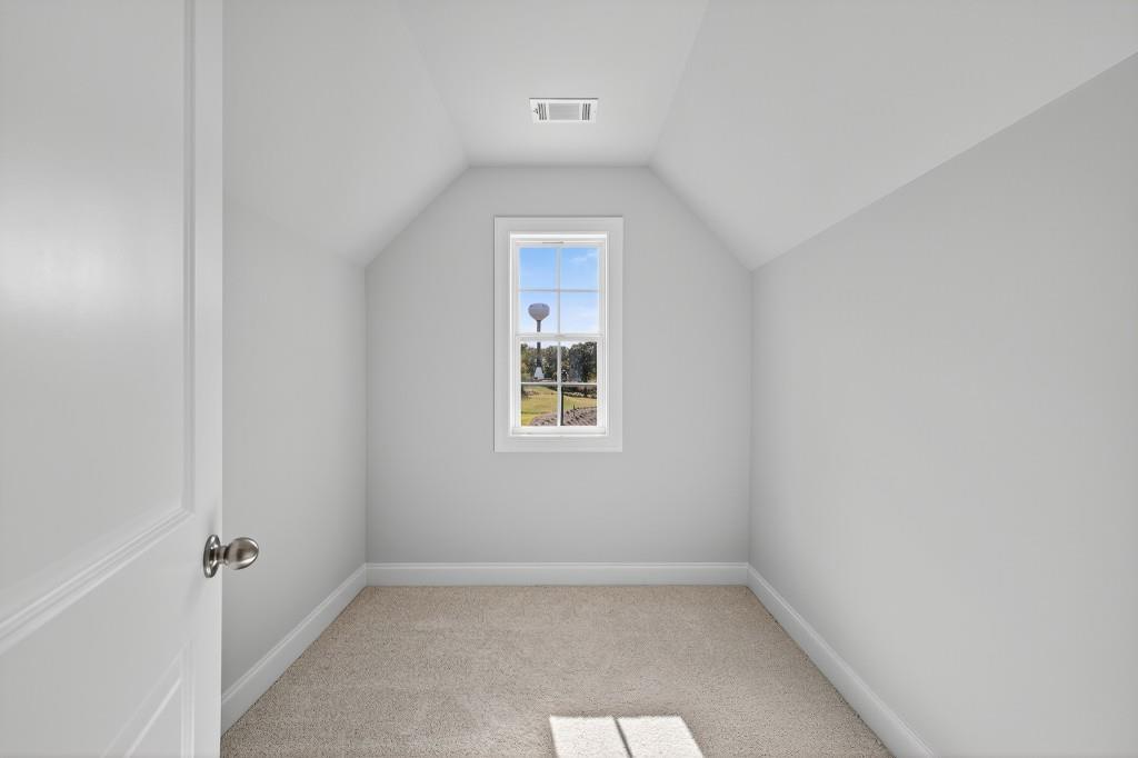 5566 Spring Street Flowery Branch, GA 30542 - Photo 26 of 66 a view of an empty room with a window